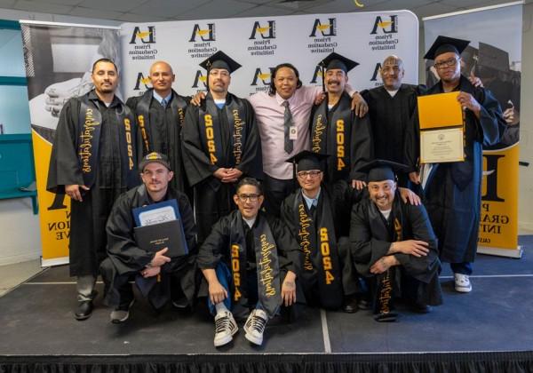 Cal State LA graduates pose together for a group photo.